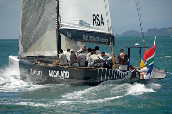 Louis Vuitton Pacific Series sees Americas Cup rival teams match race one another in other teams boats. Shown here is South Africa in USA Oracle's yacht practice