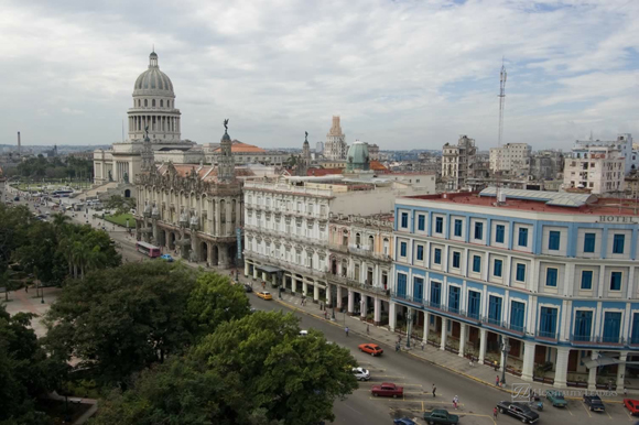 View of the west side of Havana's Parque Central, Cuba. The dome of the legislative building - the Capitolio is towards the left, with the Gran Teatro and two hotels