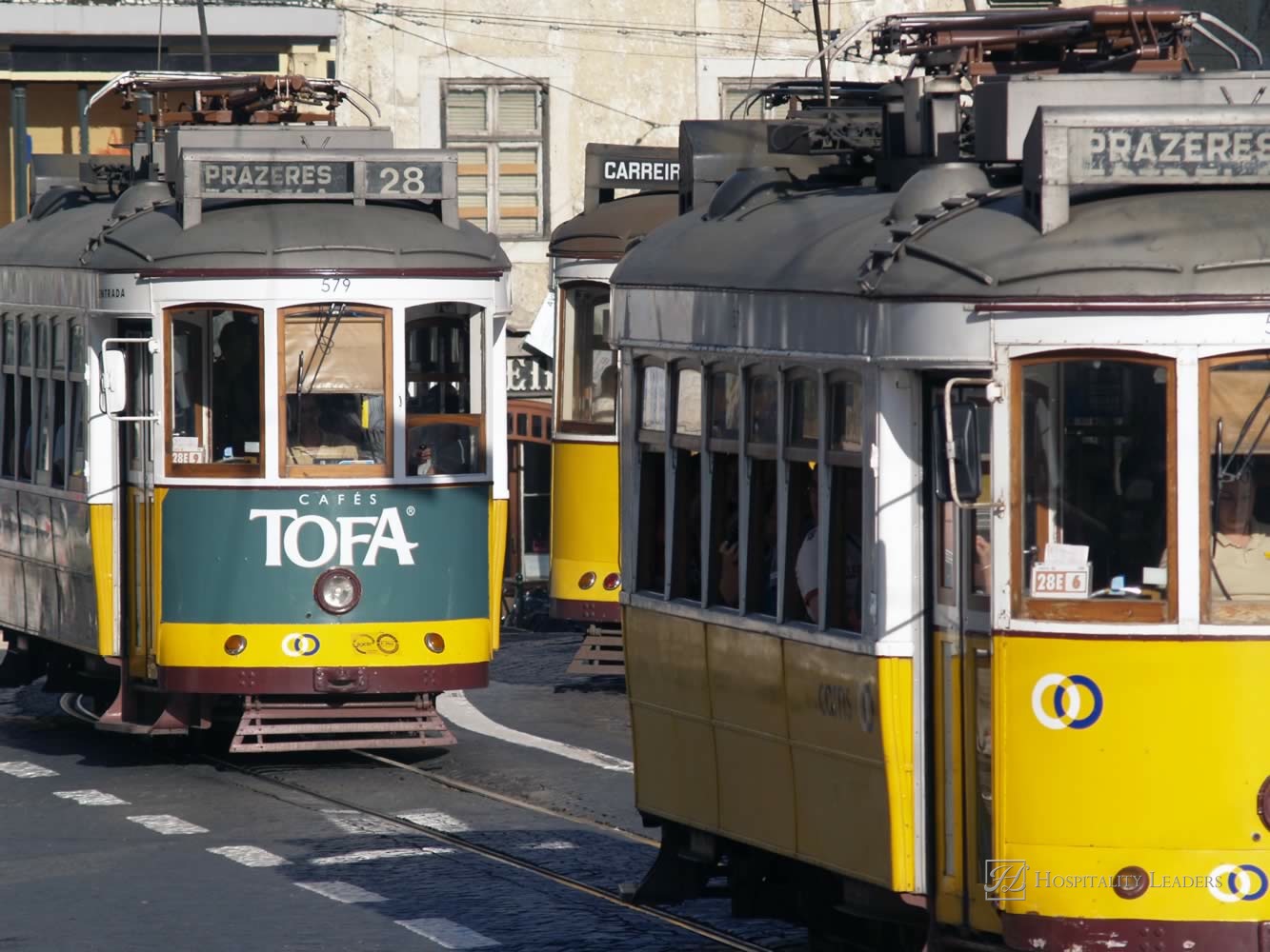 Hospitality News: LISBON, PORTUGAL - AUGUST 11: Traditional yellow and red trams downtown Lisbon on August 11, 2009. Trams are used by everyone and also keep the traditional style of the historic center of Lisbon