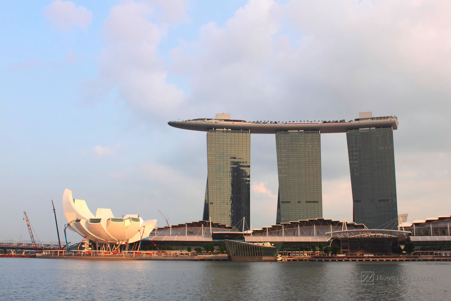 Singapore - Nov 19: The new Marina Bay Sands resort and the Singapore Flyer ferris wheel on a late afternoon on November 19, 2010 in Singapore