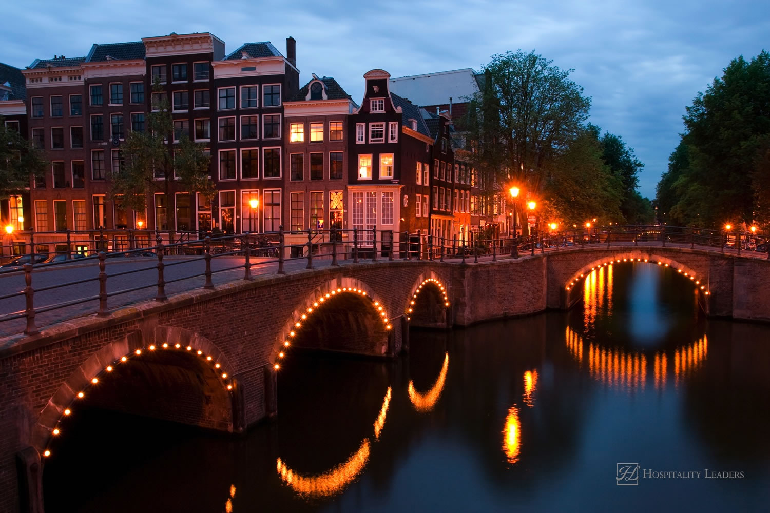 Hospitality News: One of the famous canals of Amsterdam, the Netherlands at dusk