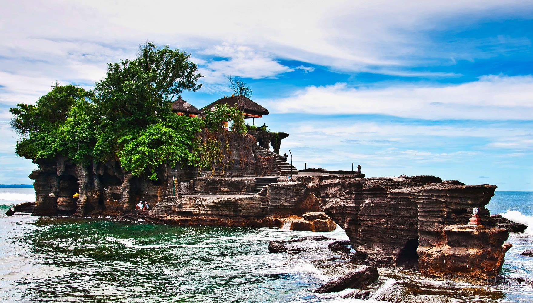 Tanah Lot means "Land Sea" in Balinese language Located in Tabanan, about 20 km from Denpasar, the temple is on offshore rock which has been shaped continuously over the years by the ocean tide