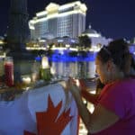 Samantha Stigen from Fargo, North Dakota, lights a candle at an impromptu memorial in front of the Bellagio to pay respect to the victims and first responders of the previous Sunday's mass shooting Tuesday, October 3, 2017. CREDIT: Sam Morris/Las Vegas News Bureau